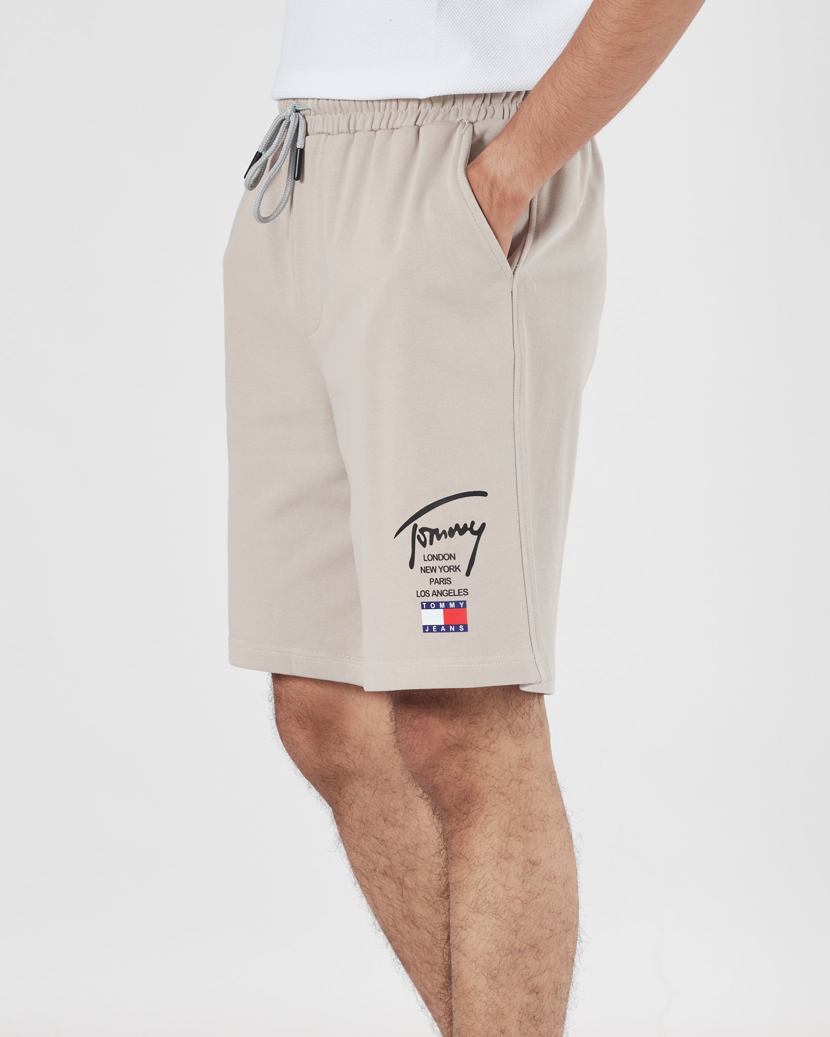 TH Signature Logo Printed Men Cream Shorts 15.90